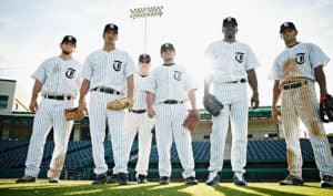 why do baseball coaches wear uniforms
